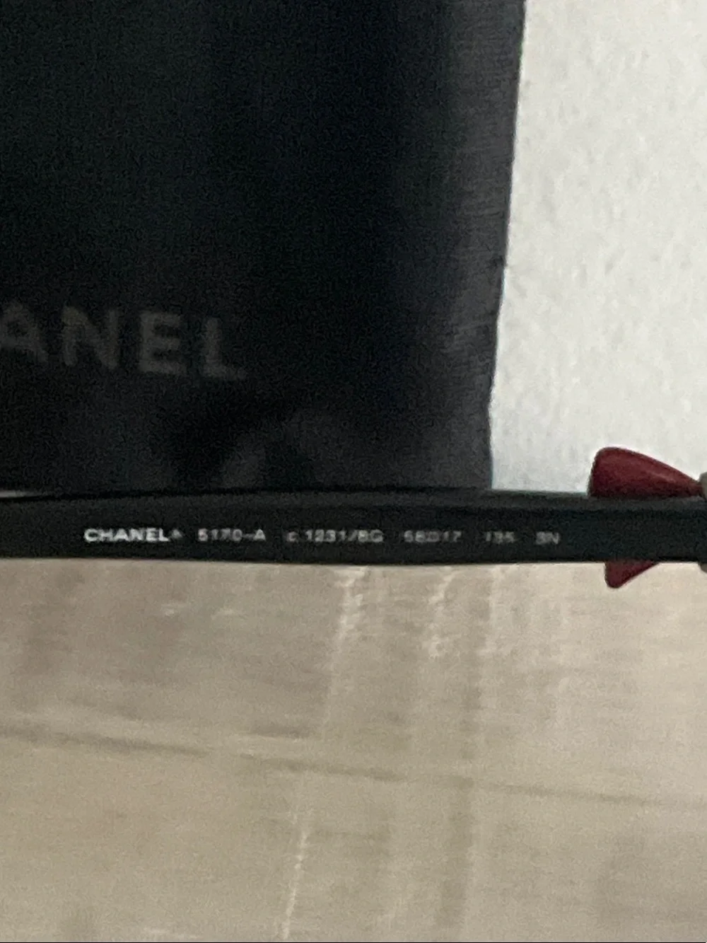 CHANEL Black Sunglasses with Red Accents and Gradient Lenses